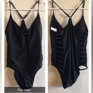 Size large black one piece swimsuit only worn to try on.